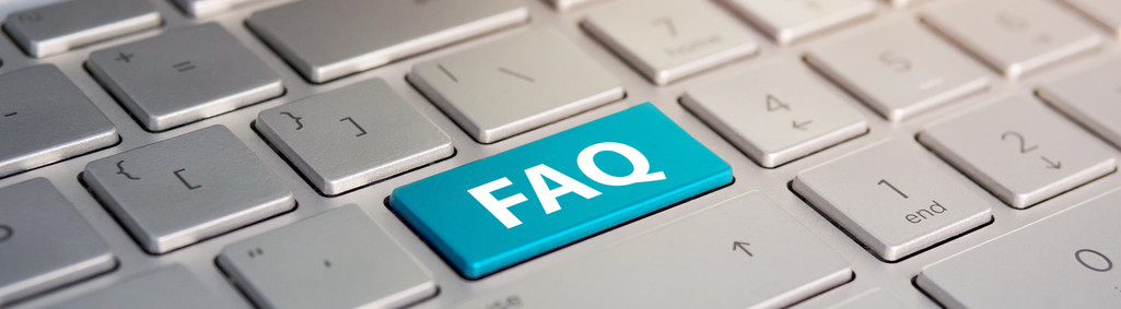 Keyboard with faq button .. Color button on the gray silver keyboard of modern ultrabook. caption on the button