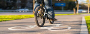 Cycle path in the city park. Bicycle sign on the road